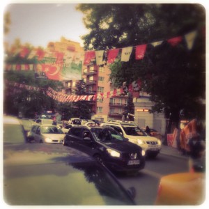 Flags declaring party allegiances flutter in the streets of Ankara.